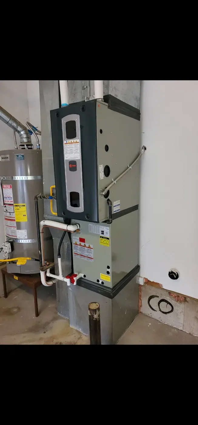 Trane gas furnace and evaporator coil installed next to water heater in a Vancouver, WA basement
