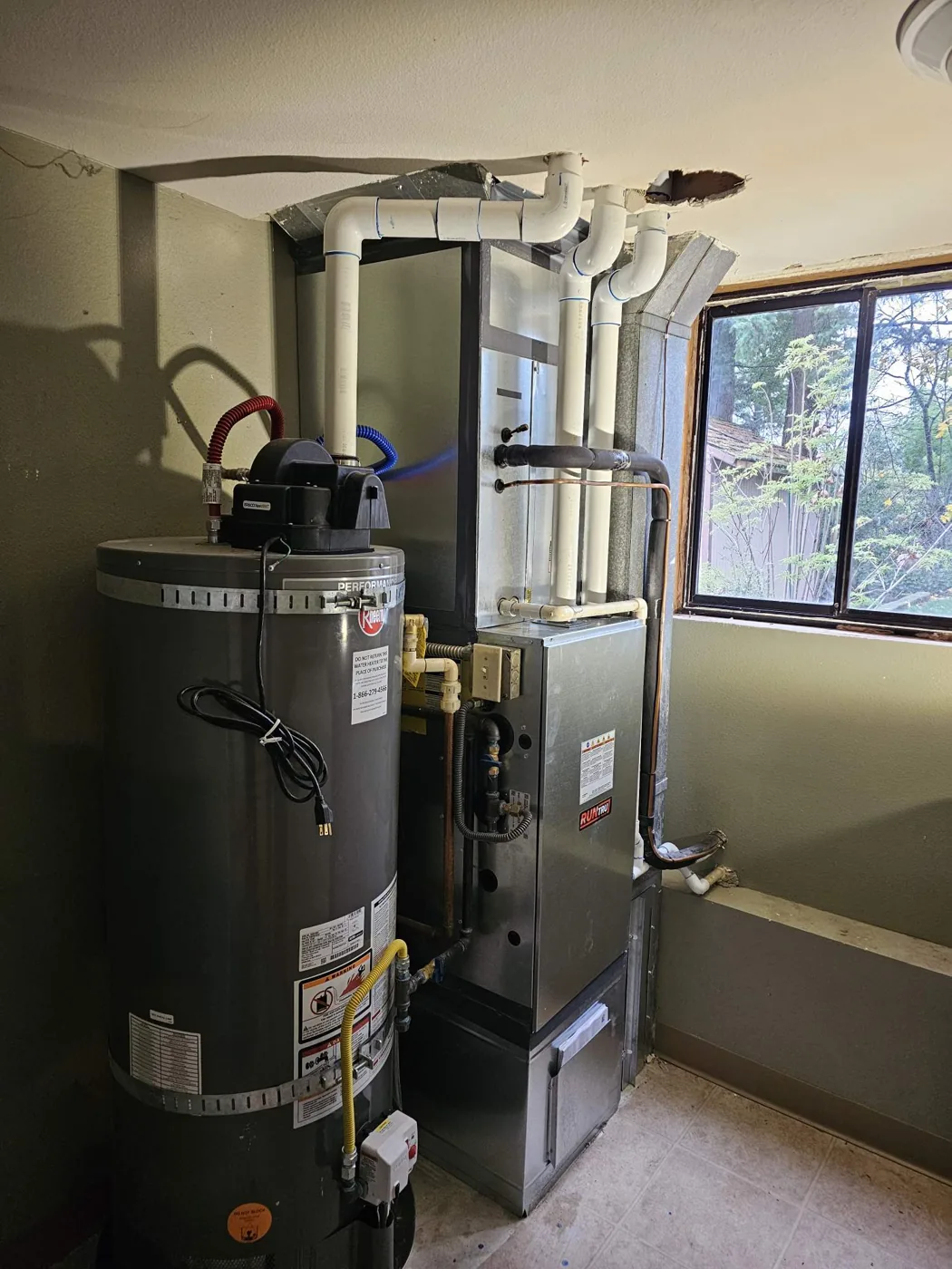 Completed gas furnace and water heater replacement with new venting in Vancouver, WA by Imperial Heating and Cooling