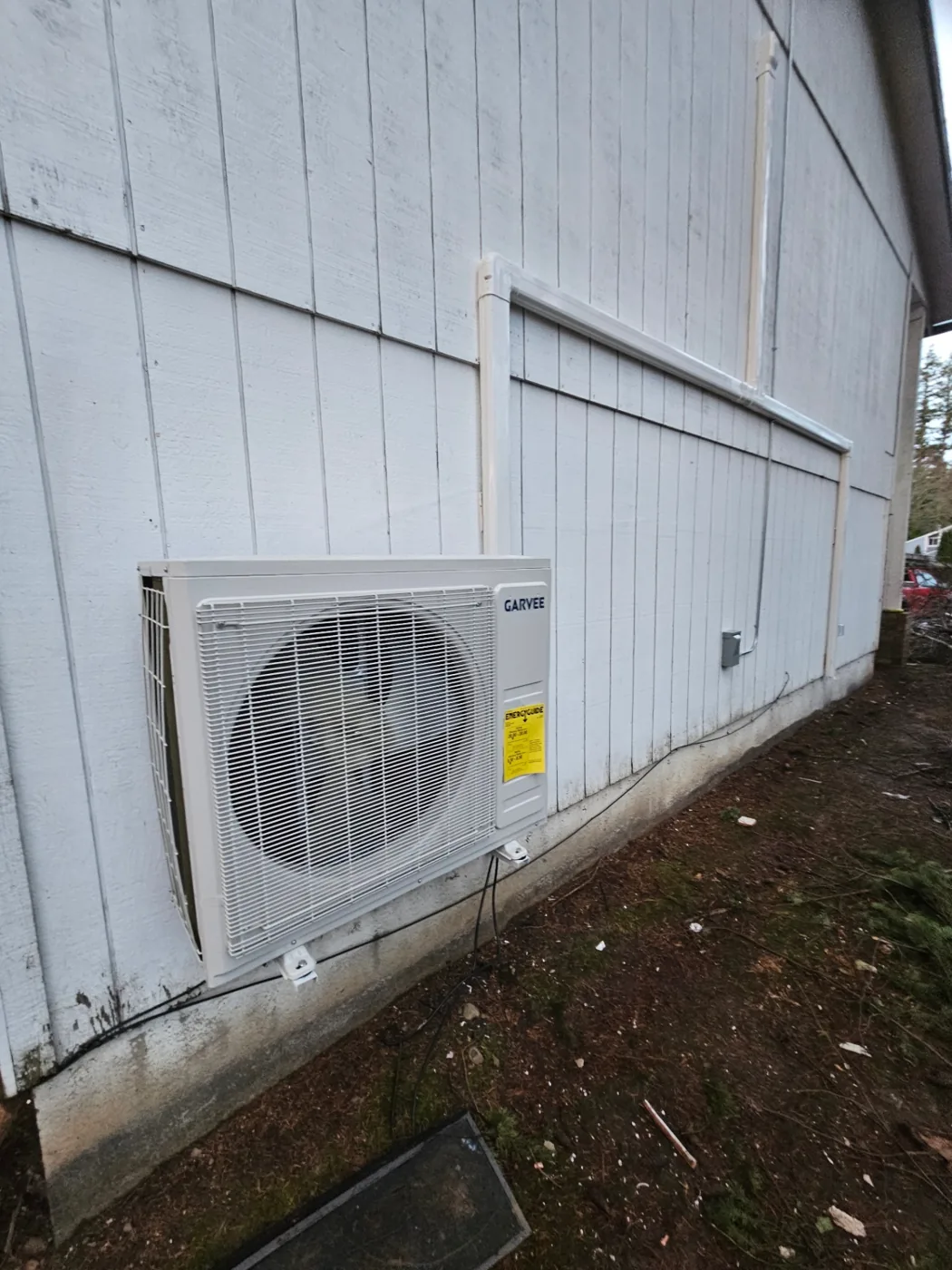 New ductless mini-split outdoor condenser mounted on exterior wall in Vancouver, Washington
